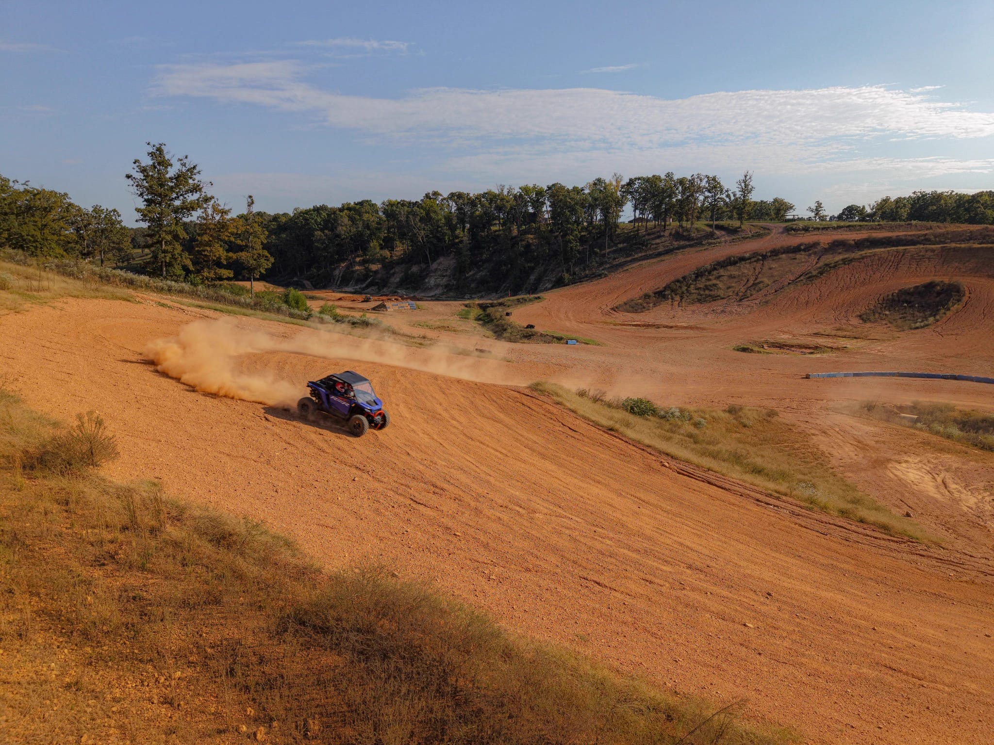 Vehicle kicking up dust on a turn
